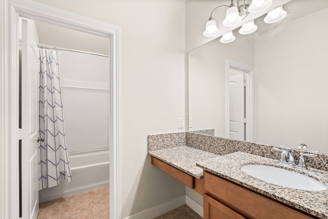 bathroom with vanity, shower / bathtub combination with curtain, tile patterned flooring, and a notable chandelier