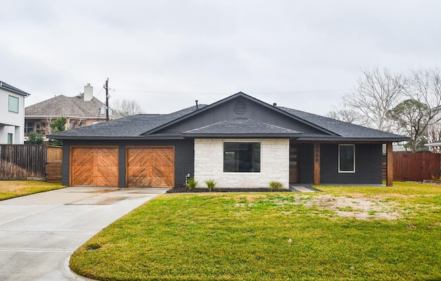 ranch-style home with a garage and a front lawn