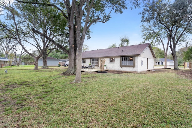 single story home featuring a wooden deck and a front lawn