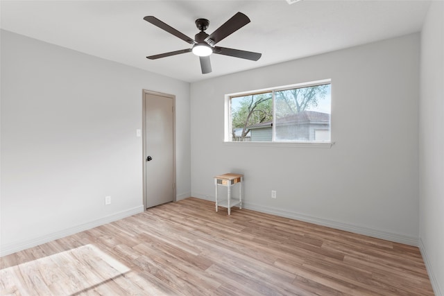 spare room featuring ceiling fan and light wood-type flooring