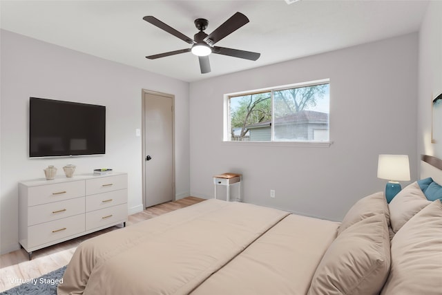 bedroom featuring ceiling fan and light hardwood / wood-style flooring