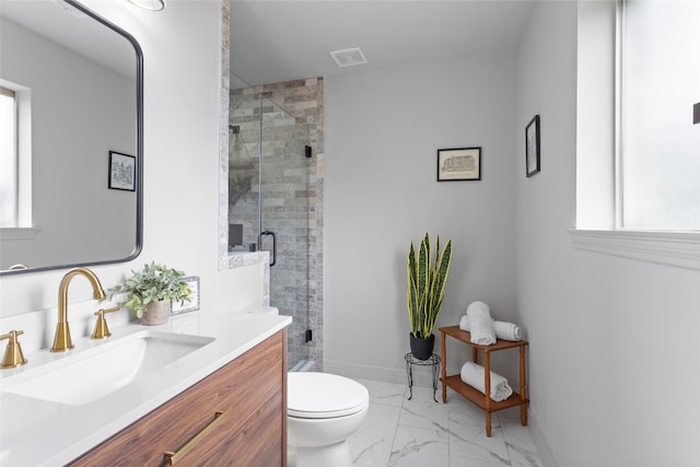 bathroom with vanity, toilet, and an enclosed shower