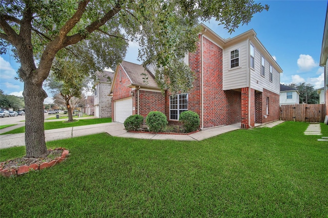 view of front facade featuring a garage and a front lawn