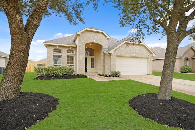 ranch-style house with a garage and a front yard