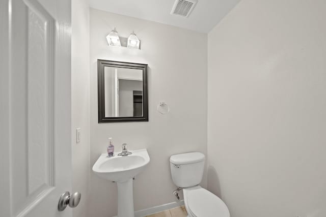 bathroom featuring toilet