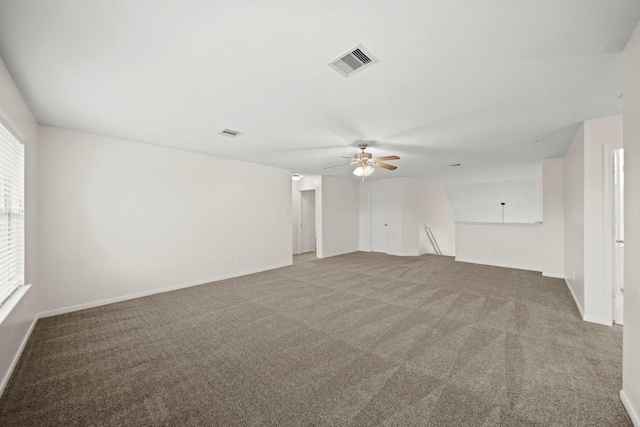 carpeted empty room featuring ceiling fan