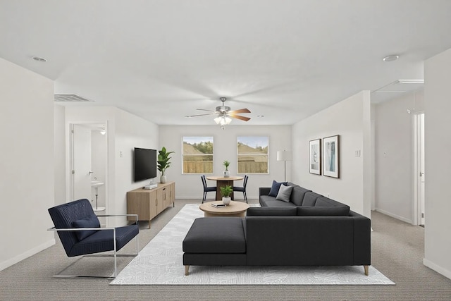 living room with ceiling fan and light carpet