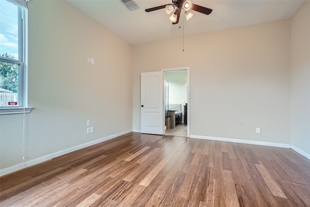 empty room with light wood-type flooring and ceiling fan