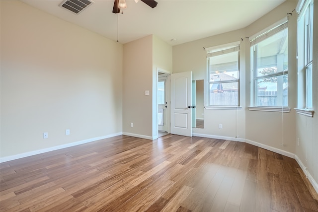 unfurnished room featuring ceiling fan and light hardwood / wood-style floors