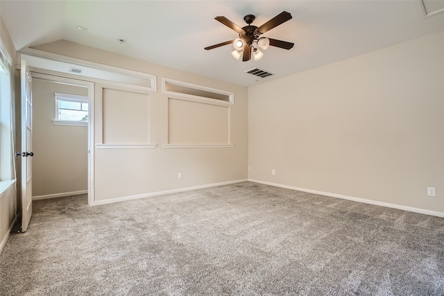 unfurnished bedroom with ceiling fan, vaulted ceiling, and carpet floors