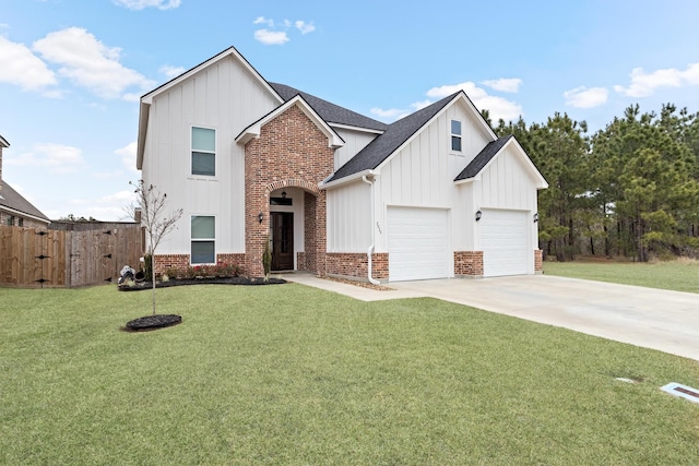 view of front of property with a garage and a front lawn