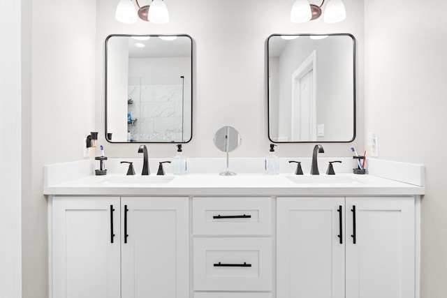 bathroom featuring walk in shower and vanity