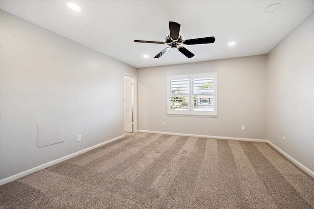 spare room featuring carpet, ceiling fan, baseboards, and recessed lighting