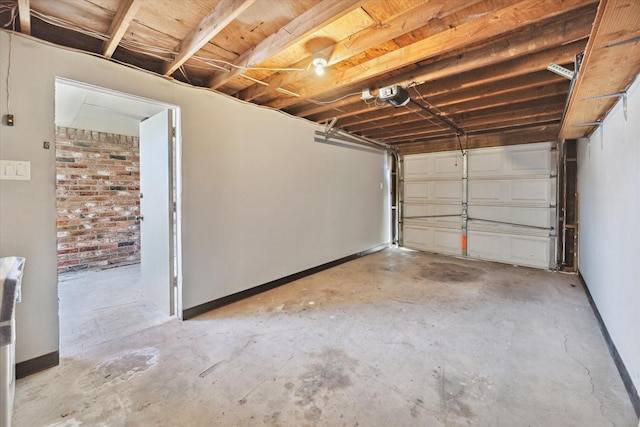 garage featuring baseboards and a garage door opener