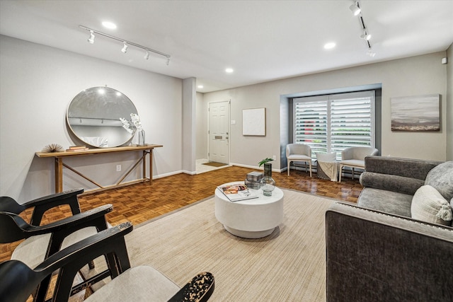 living area with track lighting, recessed lighting, and baseboards