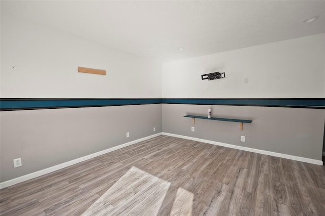 spare room featuring light hardwood / wood-style flooring