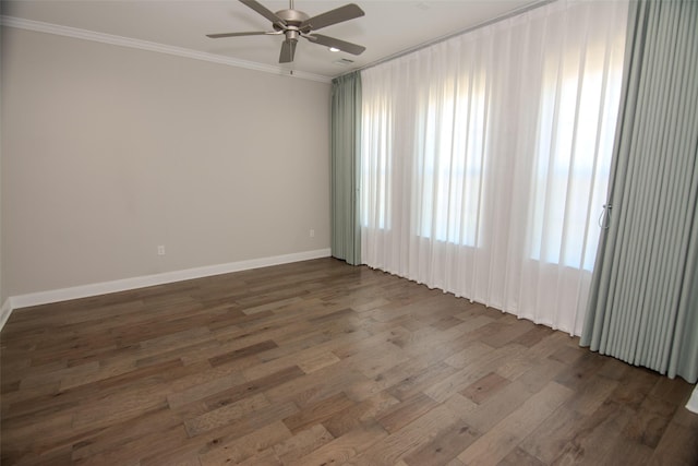 spare room featuring ceiling fan, crown molding, and dark hardwood / wood-style floors