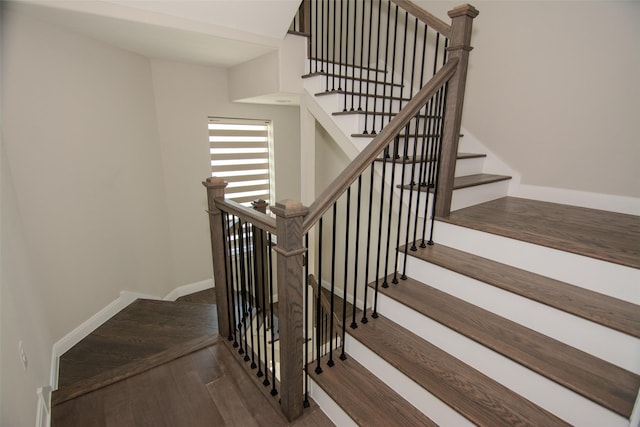 stairs with hardwood / wood-style flooring