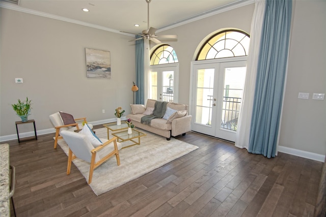 living room featuring dark hardwood / wood-style floors, crown molding, and french doors