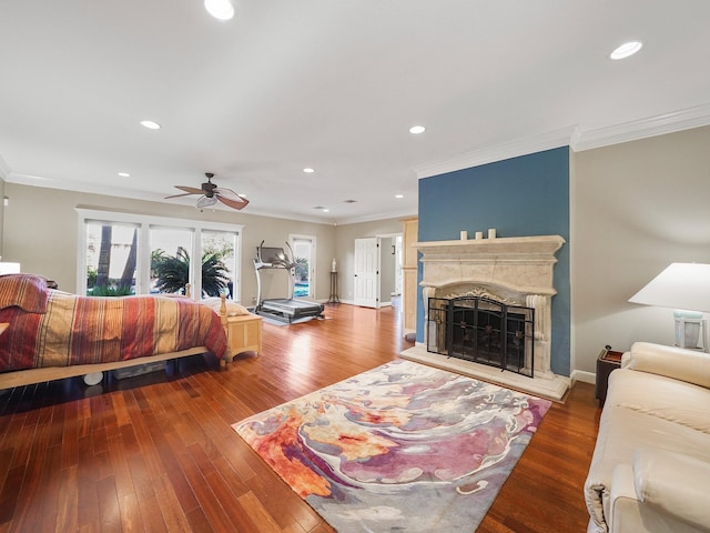 bedroom with ceiling fan, ornamental molding, and dark wood-type flooring