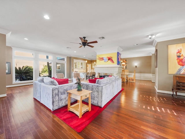 living room with ceiling fan, crown molding, and wood-type flooring