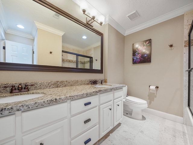 bathroom featuring a shower with shower door, vanity, and ornamental molding