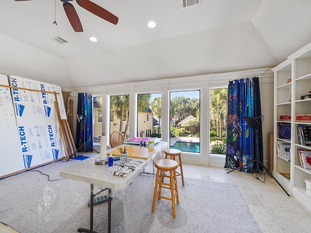 interior space featuring ceiling fan and vaulted ceiling