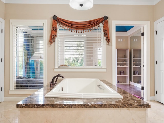 bathroom with a relaxing tiled tub and crown molding