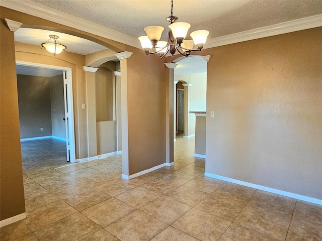 unfurnished room with tile patterned floors, a chandelier, ornamental molding, and a textured ceiling