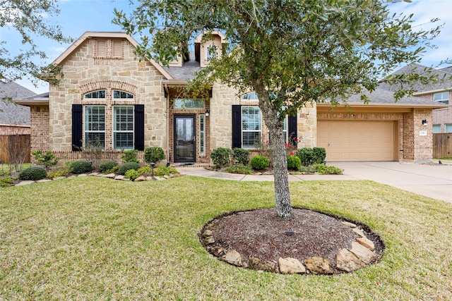 view of front of property with a garage and a front lawn