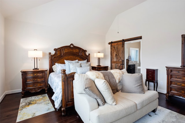 bedroom featuring vaulted ceiling, a barn door, and dark hardwood / wood-style floors