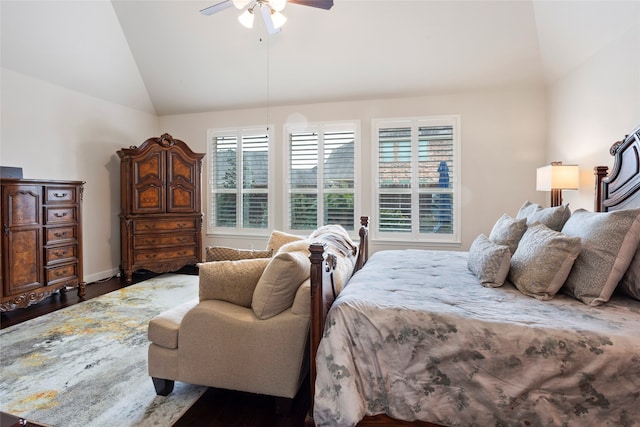 bedroom with ceiling fan, dark hardwood / wood-style floors, vaulted ceiling, and multiple windows