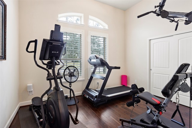 exercise area with dark wood-type flooring