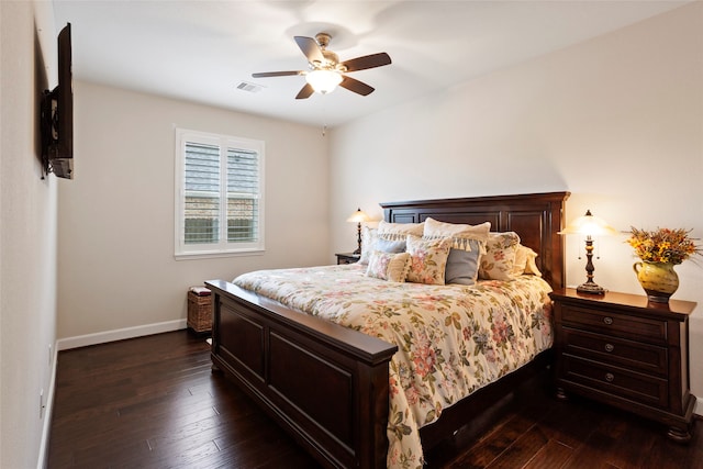 bedroom with ceiling fan and dark hardwood / wood-style flooring