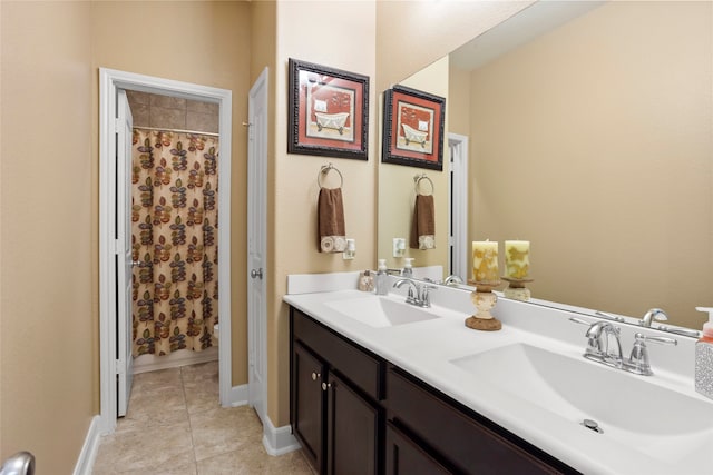 bathroom featuring vanity, a shower with curtain, and tile patterned flooring