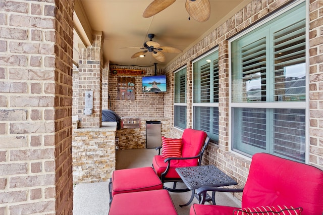 view of patio featuring exterior kitchen and ceiling fan