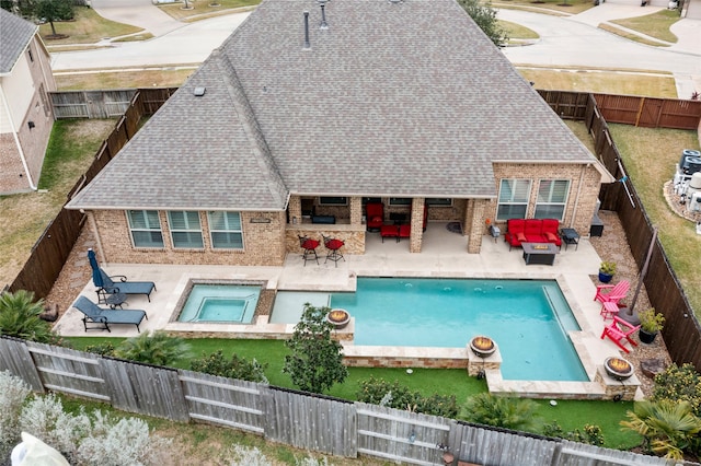 view of swimming pool featuring an in ground hot tub, outdoor lounge area, a bar, and a patio