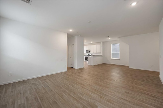 unfurnished living room with light hardwood / wood-style floors