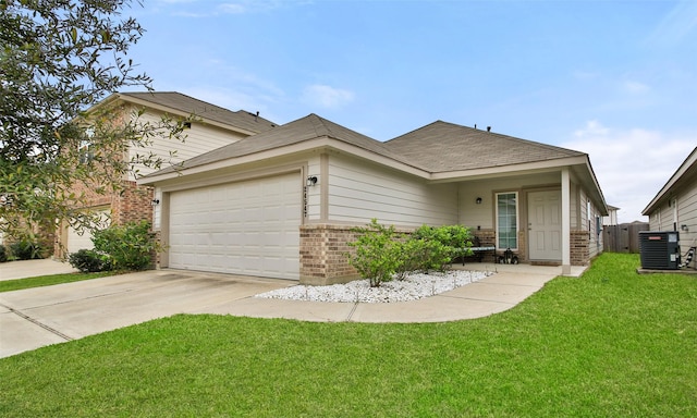 view of front facade featuring central air condition unit, a garage, and a front lawn