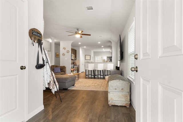 interior space featuring ceiling fan and dark hardwood / wood-style flooring