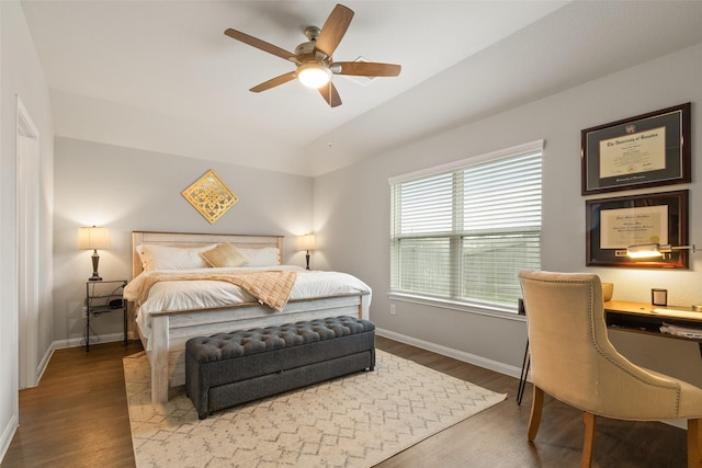 bedroom with ceiling fan, wood-type flooring, and lofted ceiling