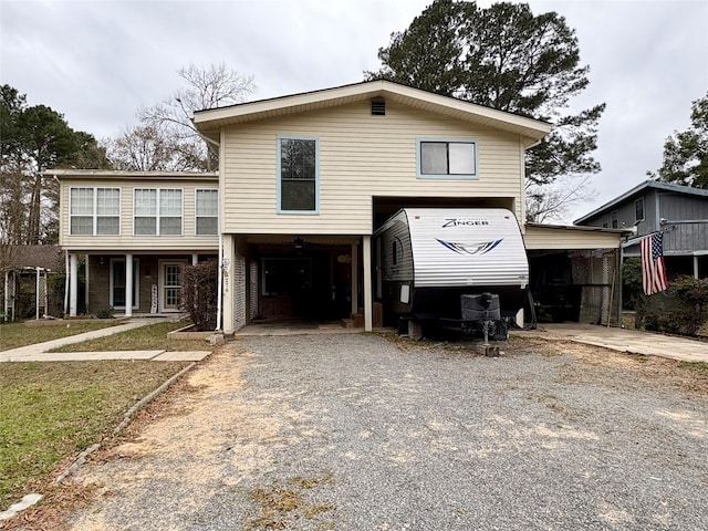 view of front of property featuring a carport