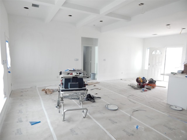 unfurnished living room featuring beamed ceiling and coffered ceiling