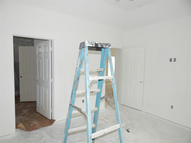 unfurnished bedroom featuring concrete floors