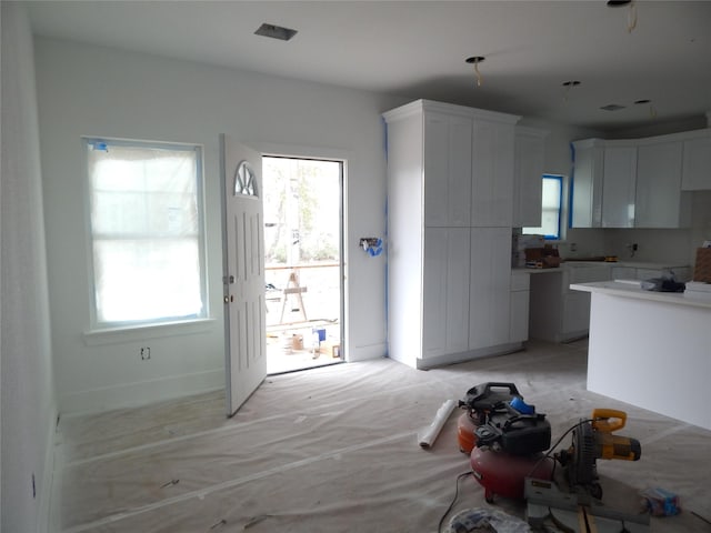 kitchen featuring white cabinetry