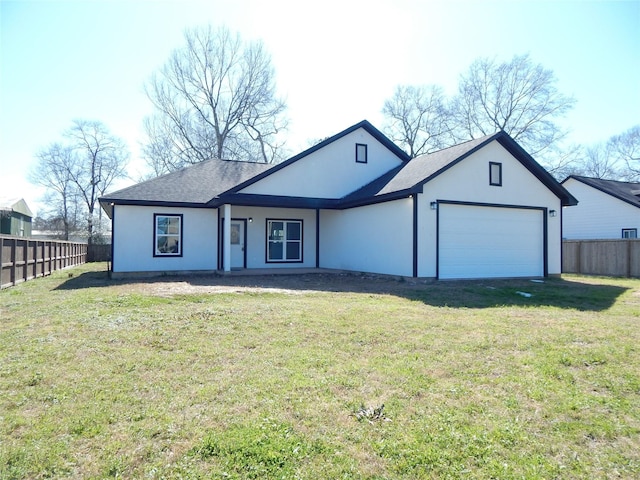 ranch-style house with a garage, driveway, fence, and a front yard