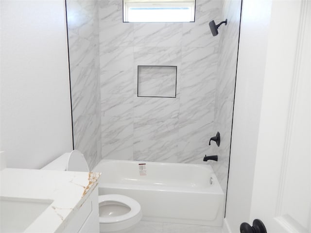 bathroom with tub / shower combination, vanity, and toilet