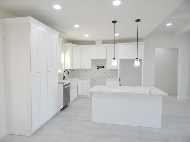 kitchen featuring a kitchen island, white cabinets, light stone countertops, dishwasher, and decorative light fixtures