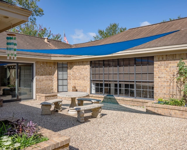 back of house with a patio area