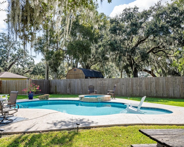 view of swimming pool featuring an in ground hot tub and a patio